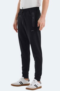 Slazenger - Slazenger VARUNA Erkek Fermuar Cepli Dar Paça Siyah Eşofman Altı Slazenger - Slazenger VARUNA Erkek Fermuar Cepli Dar Paça Siyah Eşofman Altı